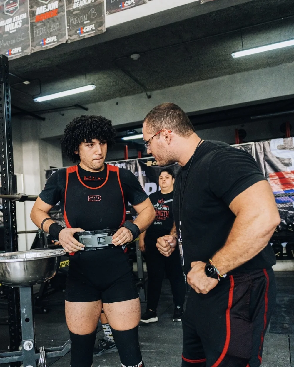 Douglas Lutz talking an athlete through an attempt at a competition