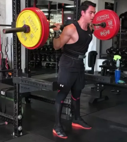 Athlete squatting in the gym during a training block