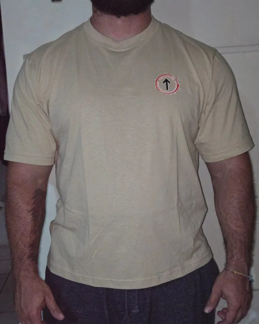 Front of the sand Lutzilla tee showing the small red chest crest