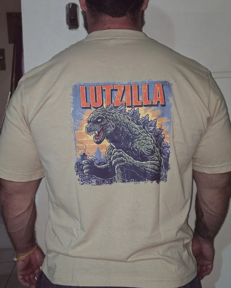 The sand-coloured Lutzilla t-shirt worn, back print
