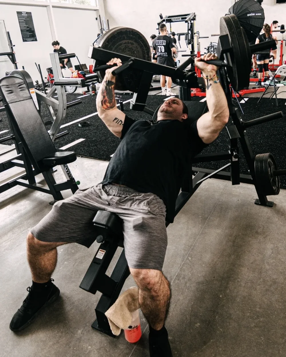 Douglas Lutz training on an incline press at the gym
